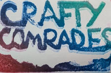 a block print in multiple colors reads "Crafty Comrades"